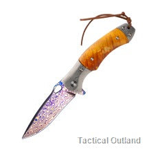 Coreless Damascus folding knife with orange handle on a white background
