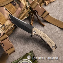 D2 steel tactical folding knife on outdoor gear