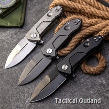 Titanium Damascus folding knives arranged on rope outdoors
