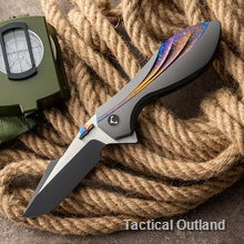 VG10 Damascus folding knife opened on a rope background
