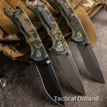 Three VG10 Damascus folding knives arranged on a tactical outdoor pack