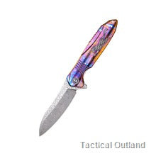 Damascus folding knife shown on a white background