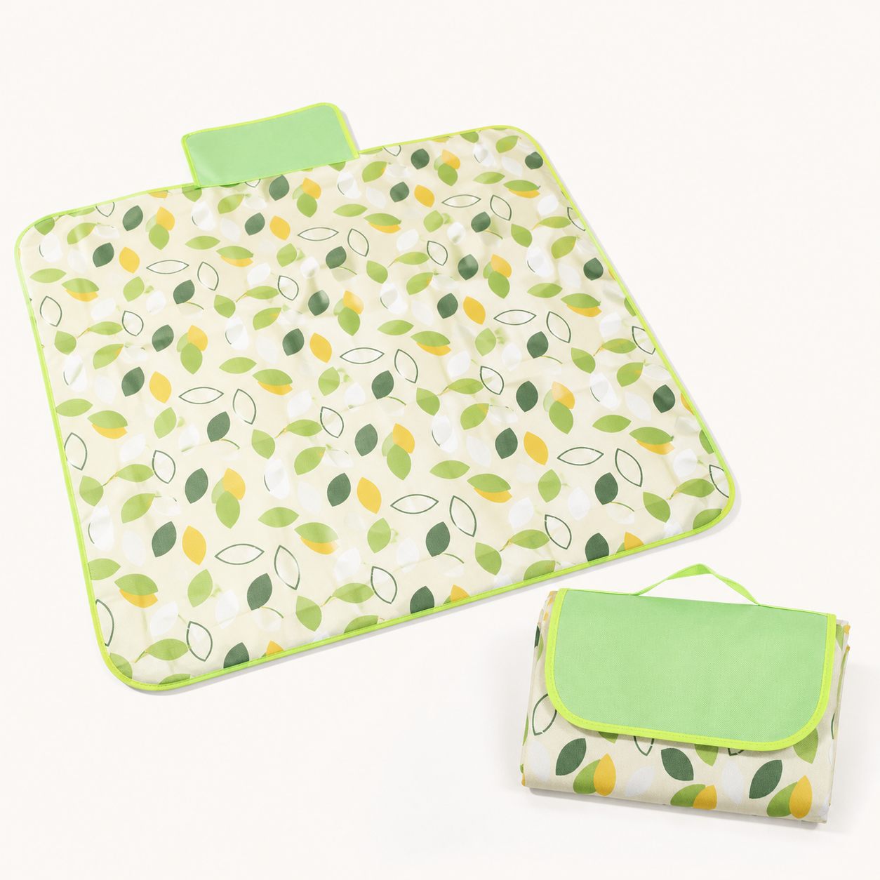 Green leaf print foldable picnic mat shown open and packed for travel
