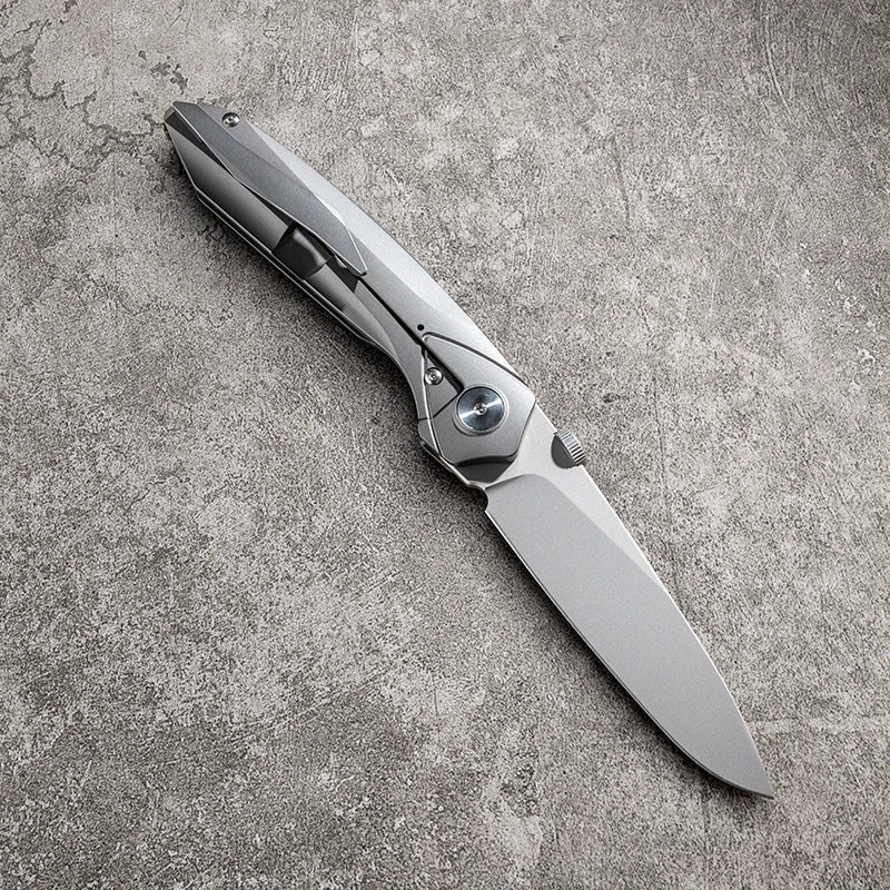 Unsharpened titanium-alloy folding knife close-up