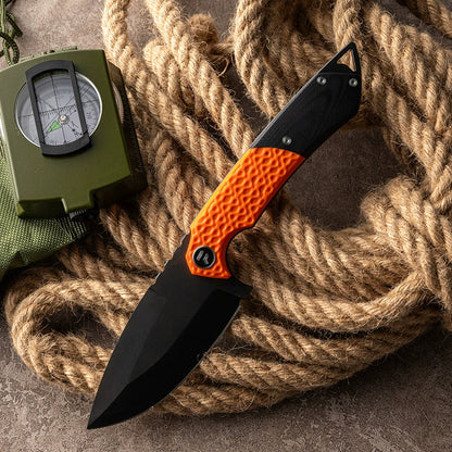 VG10 Damascus blade detail on an orange outdoor knife