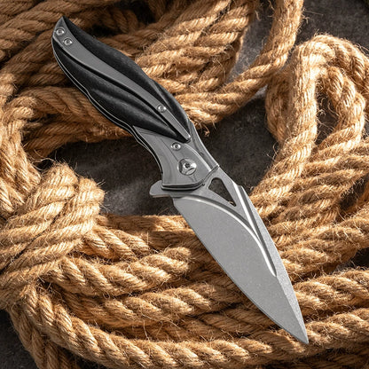 Damascus VG10 blade detail on a carbon-fiber folding knife
