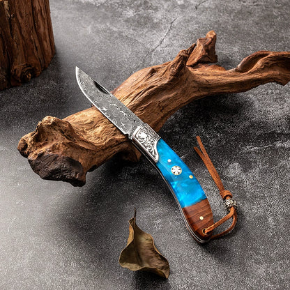 Portable camping folding knife shown open