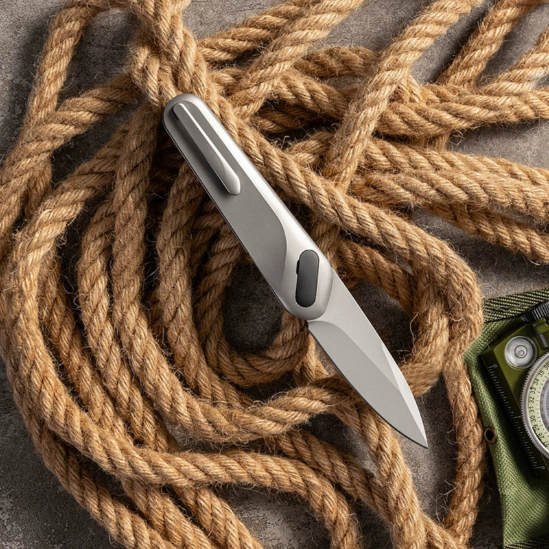 VG10 titanium-alloy folding knife on outdoor rope gear