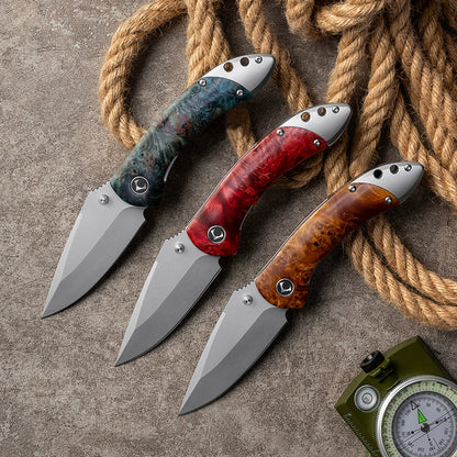 VG10 blade profile on a titanium-alloy folding knife