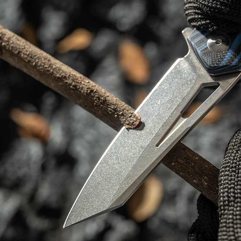 Compact Damascus folding knife shown open for outdoor use