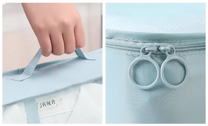 Close-up of packing cube carry handle, mesh panel and double zipper pulls