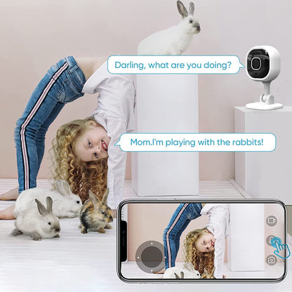 A mother using the camera app to talk to her young daughter playing in the nursery.