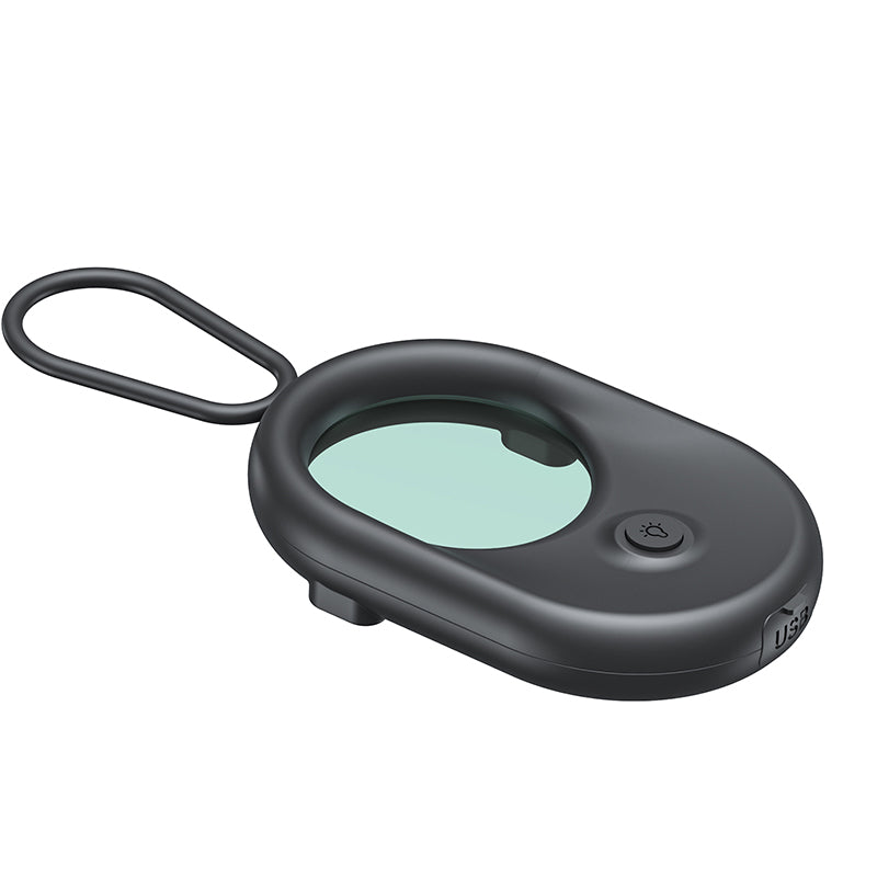 Back view of the tactical camera detector highlighting the light button and USB charging port.