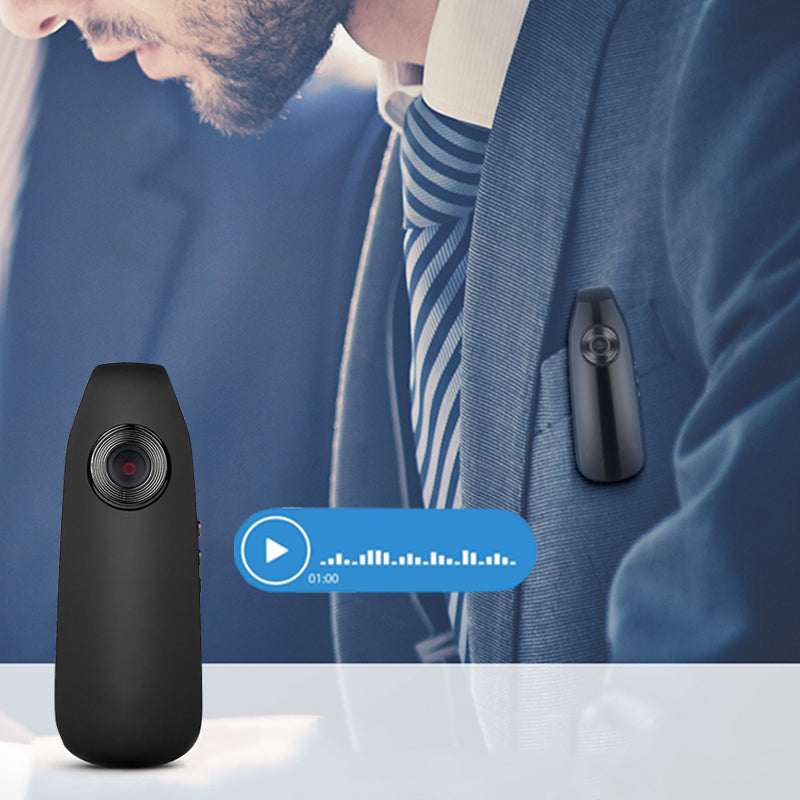 A man in a professional suit wearing the Tactical Outland 1080p HD body camera clipped to his suit pocket for discreet security recording.
