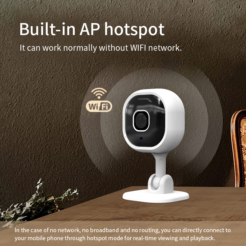 The smart WiFi camera sitting on a desk in a modern home office setting.